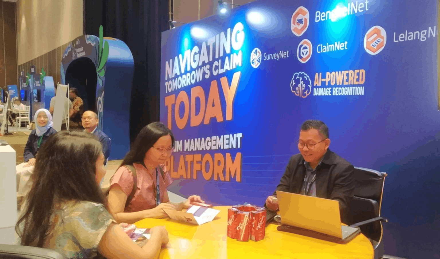 PRIMASIS.AI team at an insurance industry event showcasing the claims management platform